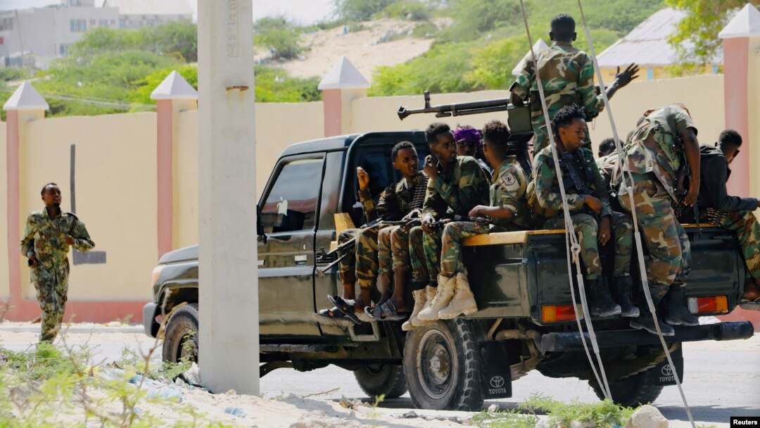 FILE - Somali soldiers are seen riding on a pick-up truck in Mogadishu, Somalia, April 27, 2022. 