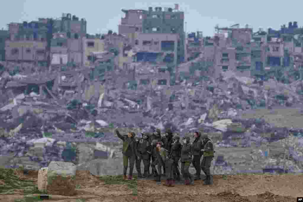 Israeli female soldiers pose for a photo on the Gaza Strip border, in southern Israel, Feb. 19, 2024.