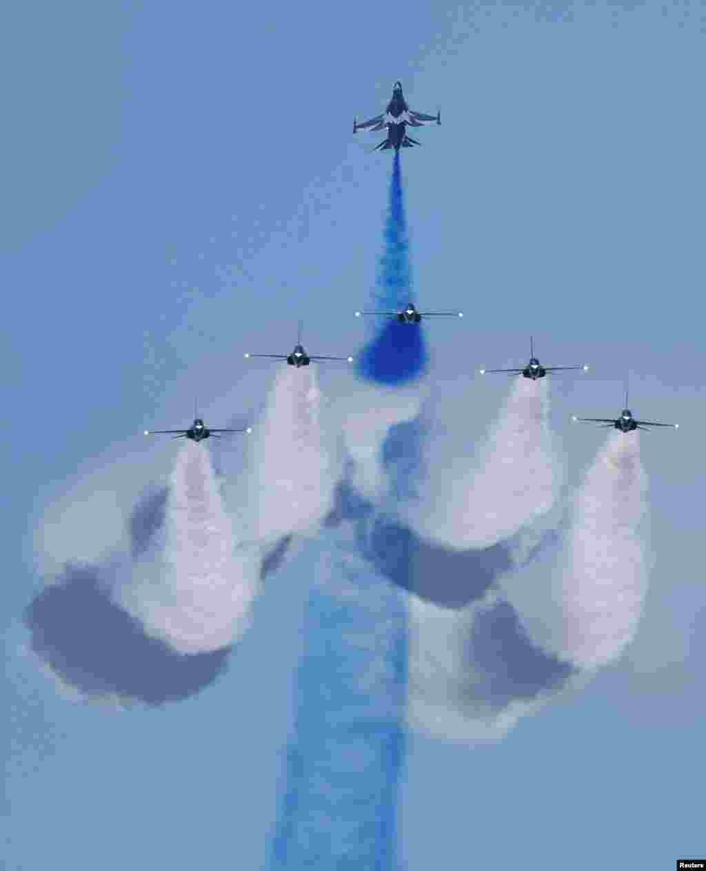 South Korean Air Force's Black Eagles aerobatic team performs during an aerial display at the Singapore Airshow at Changi Exhibition Centre, in Singapore.
