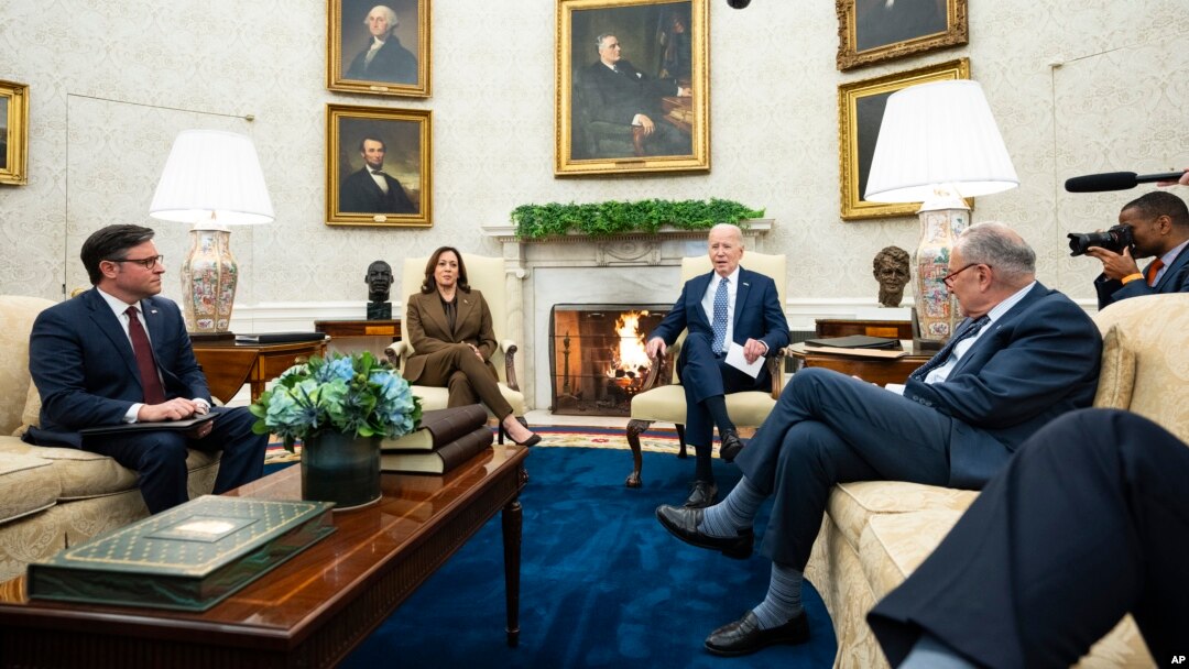 President Joe Biden speaks during a meeting with Congressional leaders in the Oval Office of the White House, in Washington, Feb. 27, 2024. From left, House Speaker Mike Johnson, Vice President Kamala Harris, Biden and Senate Majority Leader Chuck Schumer.