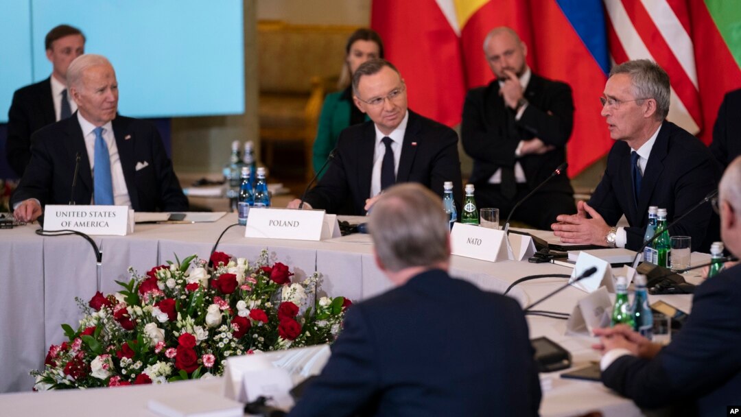 President Joe Biden, Polish President Andrzej Duda and others, listen as NATO Secretary General Jens Stoltenberg speaks during a meeting with the leaders of the Bucharest Nine, a group of countries on the eastern flank of NATO, in Warsaw, Feb. 22, 2023. 