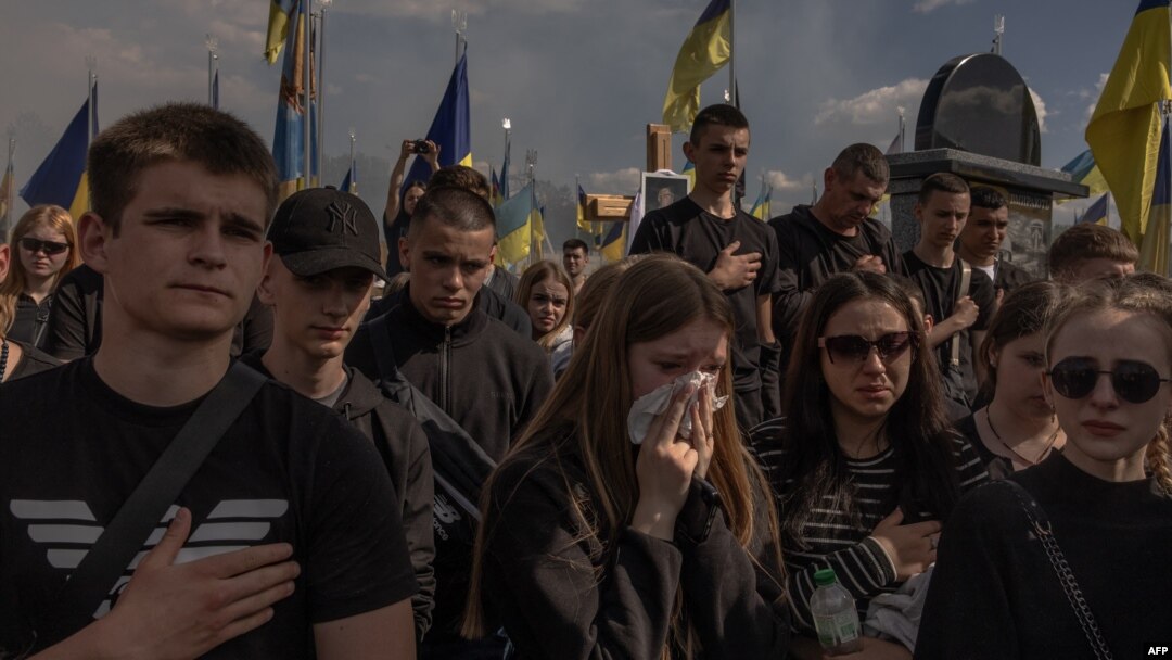 People attend the funeral ceremony for Ukrainian soldier Nazary Gryntsevych, who was killed on the battlefield, at a football stadium in Vinnytsia, Ukraine, on May 10, 2024.