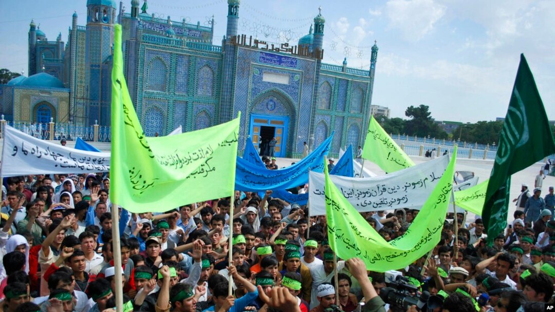 FILE - Afghans protest reports of Christian foreign aid groups proselytizing in the Islamic nation, at Mazar-i-Sharif, June 8, 2010. It was confirmed Sept. 15, 2023, that the Taliban have detained 18 people for allegedly preaching Christianity.