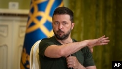 Ukrainian President Volodymyr Zelenskyy gestures during a press conference in Kyiv, July 15, 2024. 