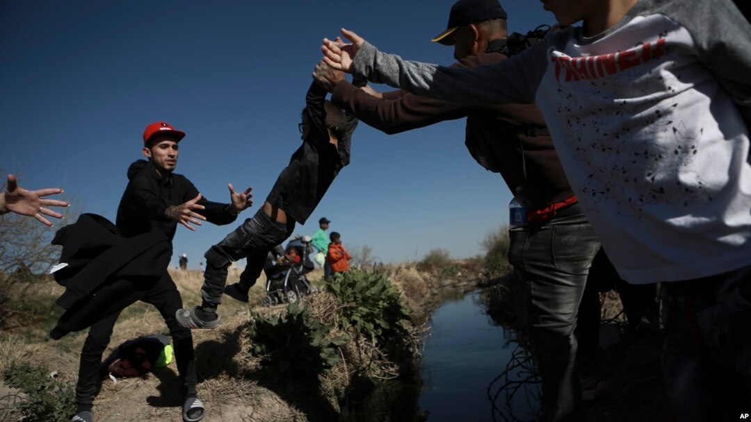 Migrants cross the Rio Grande river into the United States from Ciudad Juarez, Mexico, March 29, 2023. The image was part of a series by Associated Press photographers that won the 2024 Pulitzer Prize for feature photography.