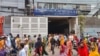 Bangladesh factories, banks reopen as curfew is eased after protests taper off 