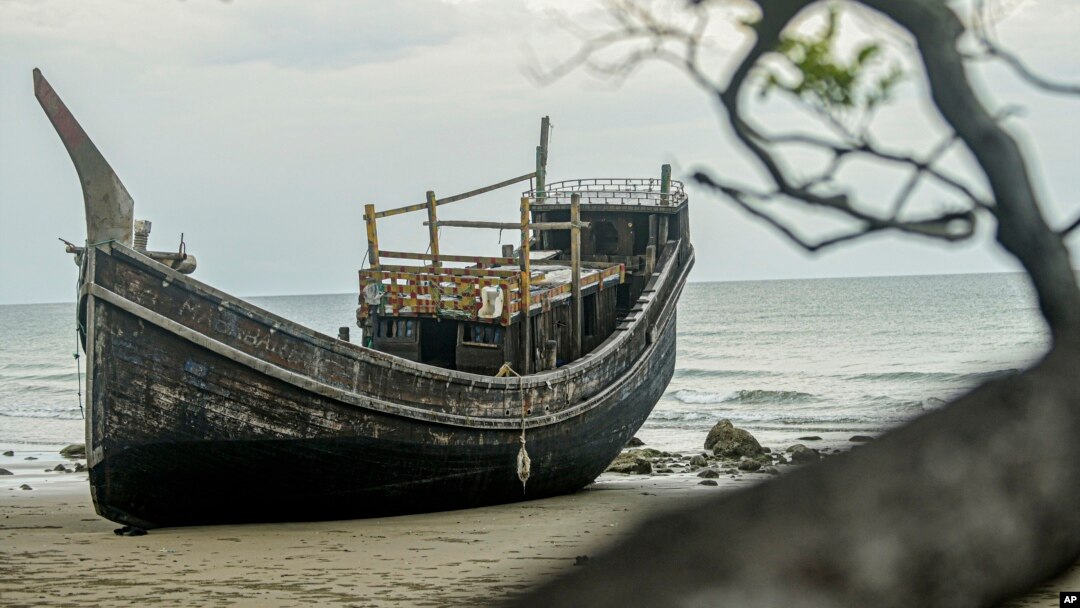 The boat used to carry a group of Rohingya Muslims sits on the beach where it landed on Dec. 10 in Pidie, Aceh province, Indonesia, Dec. 16, 2023.