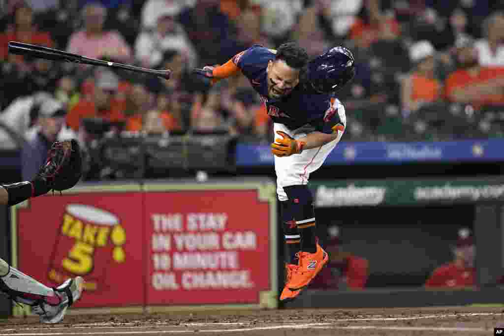 Houston Astros&#39; Jose Altuve reacts after being hit by a pitch thrown by Washington Nationals starting pitcher Josiah Gray during the first inning of a baseball game, June 14, 2023, in Houston, Texas.