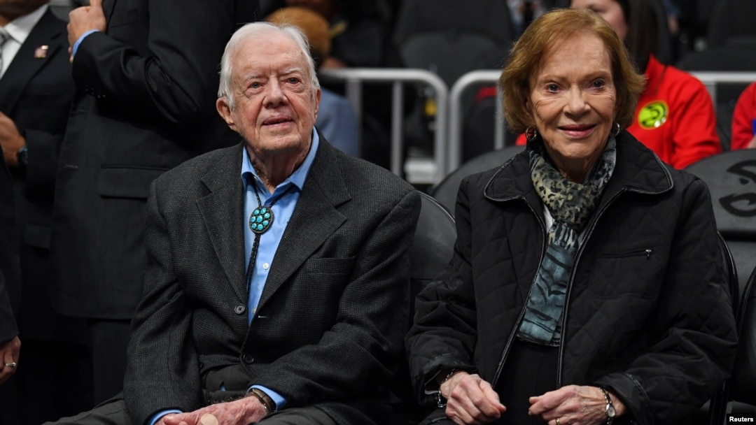 FILE - Former President Jimmy Carter, left, and his wife, Rosalynn, attend an NBA game in Atlanta, Georgia, Feb. 14, 2019. (Dale Zanine-USA Today Sports via Reuters)