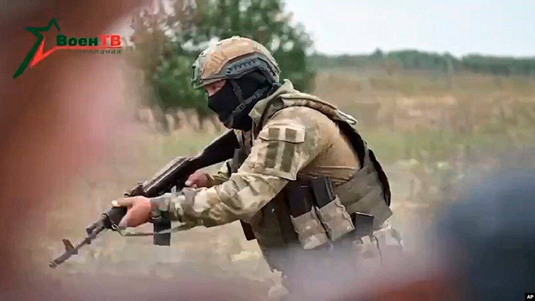 FILE - In this video still released by Belarusian Defense Ministry via VoenTV on July 14, 2023, a member of the Wagner Group shows his skills to Belarusian soldiers during a training near Tsel. Niger's military junta has reportedly asked for help from the Russian mercenary group.