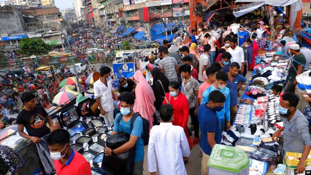 FILE - People shop at a market in Dhaka, Bangladesh, July 16, 2021. According to the Bangladesh Bureau of Statistics, the country's GDP expanded by 3.78% in the second quarter of the current fiscal year, down from 7% a year earlier. 