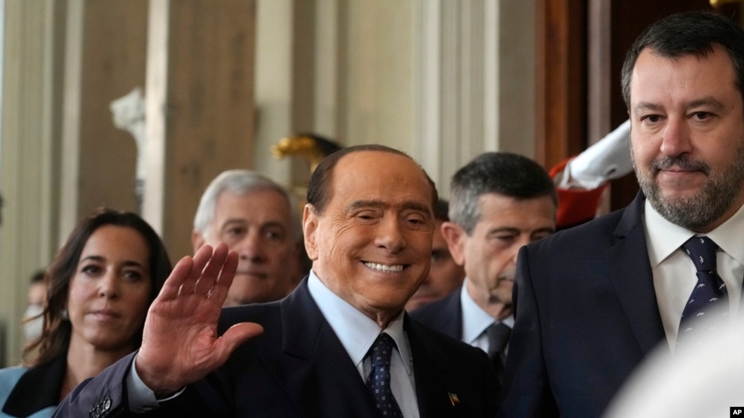FILE - Forza Italia's president Silvio Berlusconi waves, center, flanked by The League leader Matteo Salvini, right, and Senator Licia Ronzulli, left, as they arrive at the Quirinale Presidential Palace, Oct. 21, 2022.