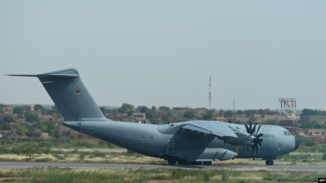 FILE - A German Air Force plane is seen on the tarmac of the Diori Hamani airport in Niamey, Niger, Sept. 22, 2023. The German army will end operations at its air base in Niger by Aug. 31, 2024.