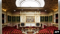 FILE - A general view shows empty seats at France's National Assembly in Paris on July 8, 2024, a day after the second round of France's legislative election.