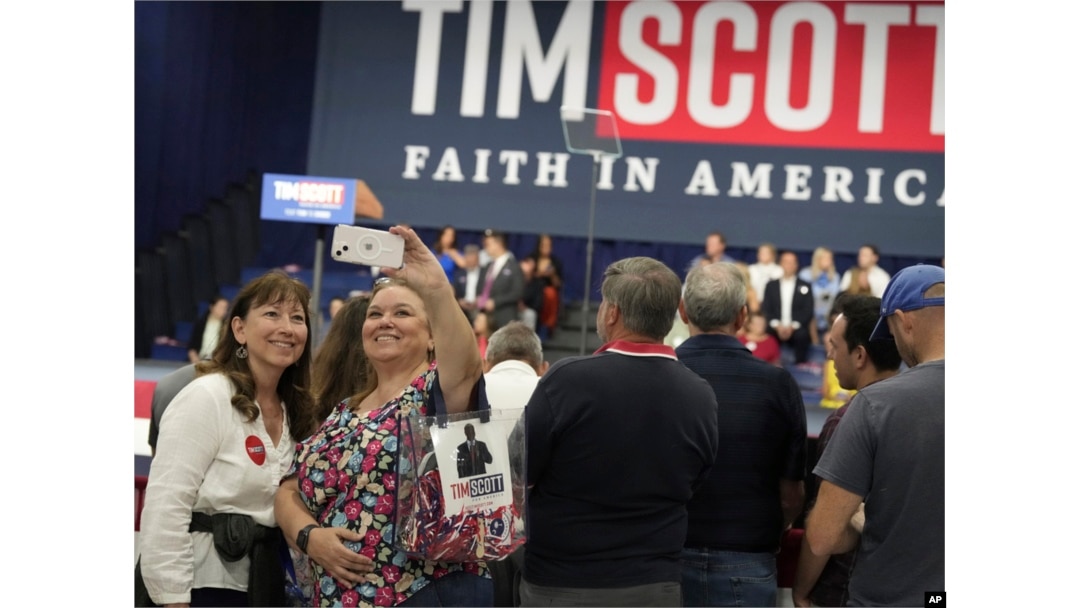 Supporters take selfies ahead of the presidential campaign launch of Senator Tim Scott, in North Charleston, South Carolina, May 22, 2023.