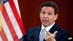 FILE - Florida Gov. Ron DeSantis answers questions at the state Capitol in Tallahassee, Florida, March 7, 2023.