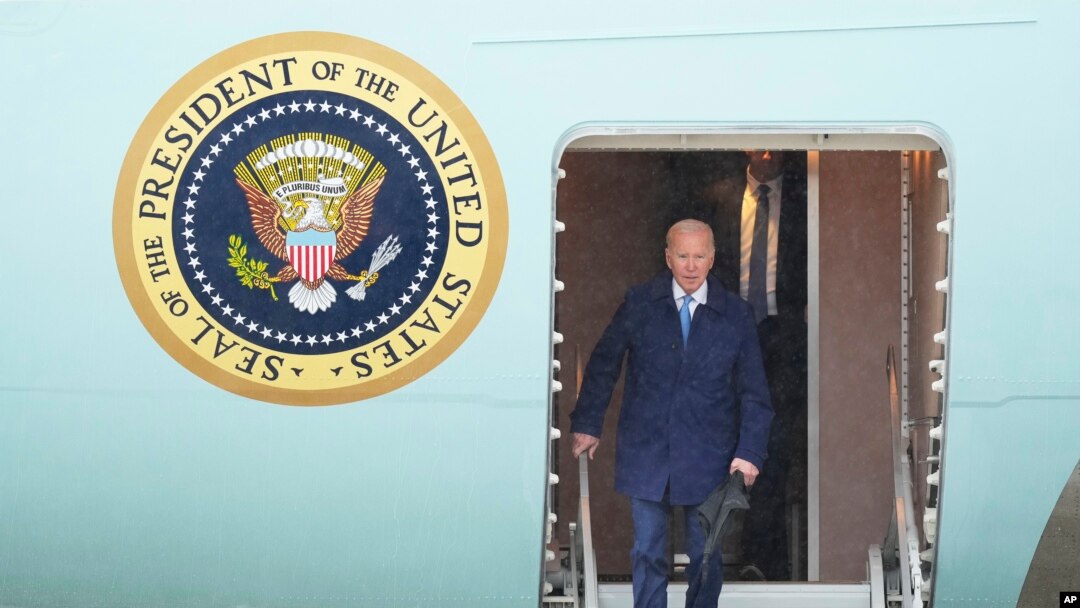 U.S. President Joe Biden walks down the steps of Air Force One upon arrival at Marine Corps Air Station Iwakuni, western Japan, May 18, 2023, en route to Hiroshima for the Group of Seven nations' summit.