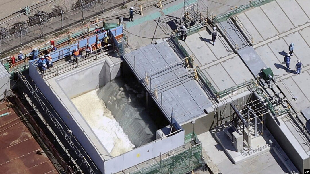 This aerial view shows the treated water diluted by seawater flowing into a secondary water then into a tunnel for an offshore discharge at the Fukushima Daiichi nuclear power plant in Fukushima, Japan, Aug. 24, 2023.
