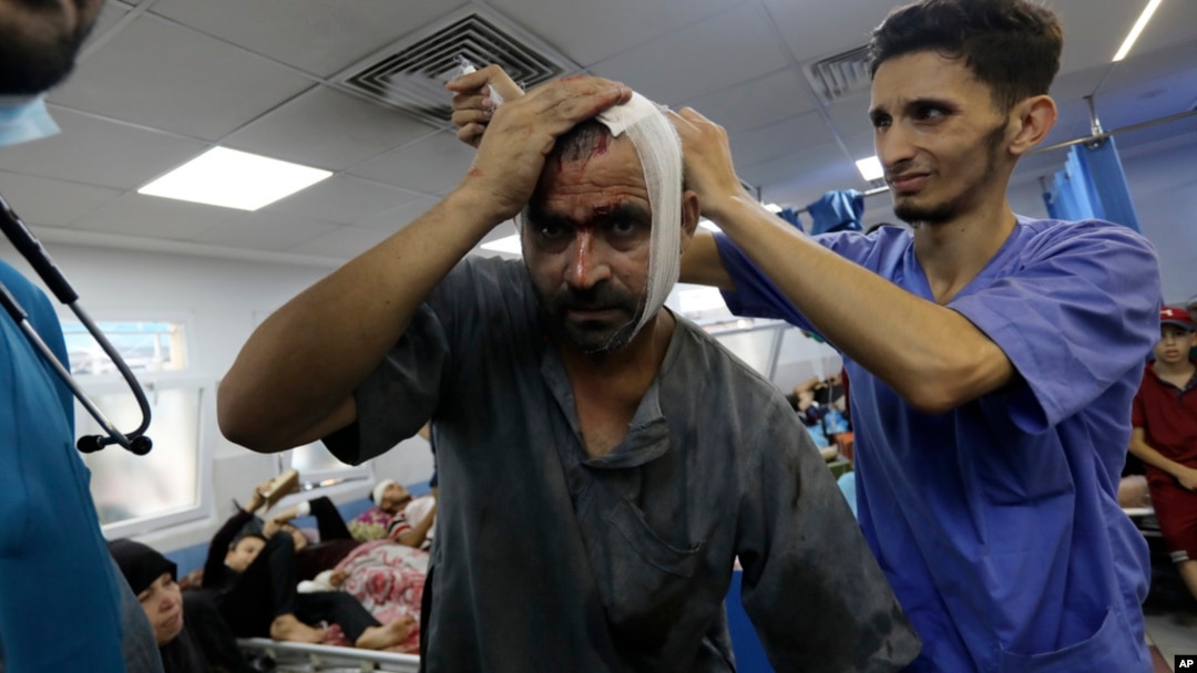 An injured Palestinian man receives treatment at the al-Shifa hospital, following Israeli airstrikes on Gaza City, central Gaza Strip, Nov. 5, 2023.