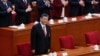 资料照片: 2024年3月11日习近平出席全国人民代表大会闭幕会议