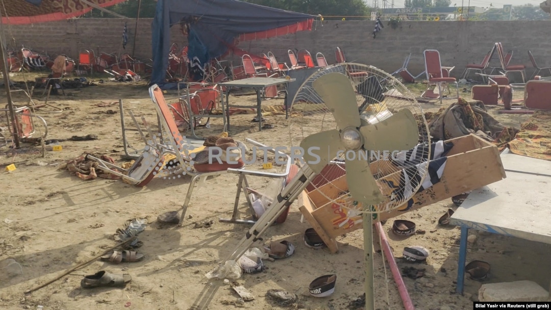 This screen grab taken from a social media video shows the aftermath of an explosion by a suicide bomber in Bajaur district, Pakistan, July 31, 2023. People were said to be sitting under a large tent, listening to a speaker, when the explosives went off. (Bilal Yasir/via Reuters)