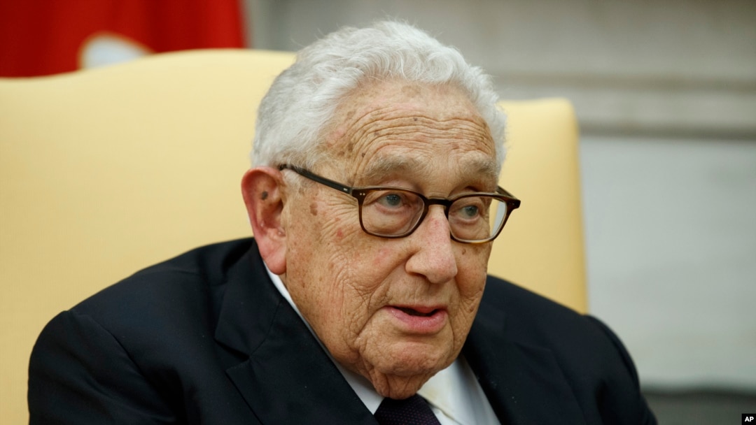 FILE - Former Secretary of State Henry Kissinger speaks during a meeting with President Donald Trump in the Oval Office of the White House, Oct. 10, 2017, in Washington. 