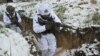 Ukrainian servicemen of the 43rd Mechanized Brigade in snow camouflage take part in a military training in an undisclosed location in the Kharkiv region on Dec. 1, 2023, amid the Russian invasion of Ukraine.