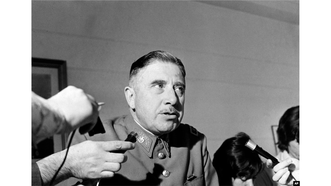 FILE - Gen. Augusto Pinochet, head of he Santiago, Chile military garrison, announces measures for the state of emergency installed by the government after rioting in downtown Santiago, Dec. 2, 1971.