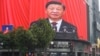 中国浙江省杭州市街头大屏幕直播放习近平在中共二十大开幕式上的讲话。（2022年10月16日）