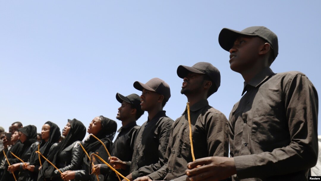 Mourners hold candles during a memorial service for the victims of the Ethiopian Airlines Flight ET302 Boeing 737 Max plane crash near Bishoftu, Ethiopia, March 8, 2020. 