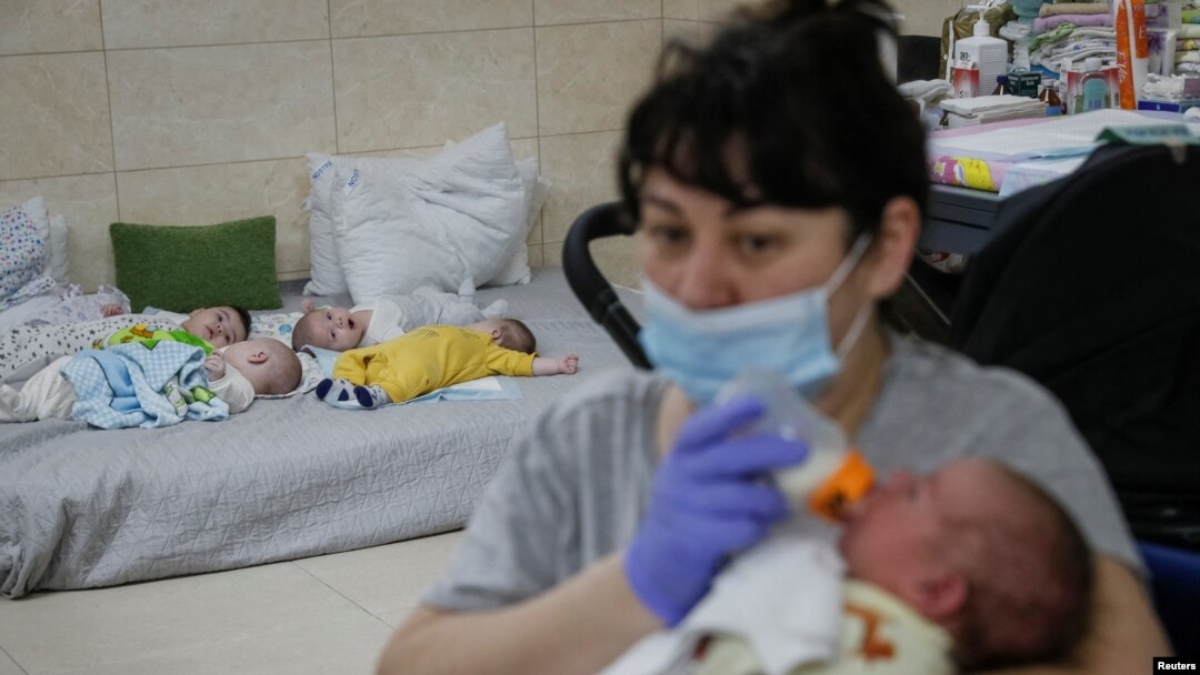 Nurse Oksana Martynenko looks after surrogate born babies inside a special shelter owned by BioTexCom clinic in a residential basement, on the outskirts of Kyiv, Ukraine, March 15, 2022.