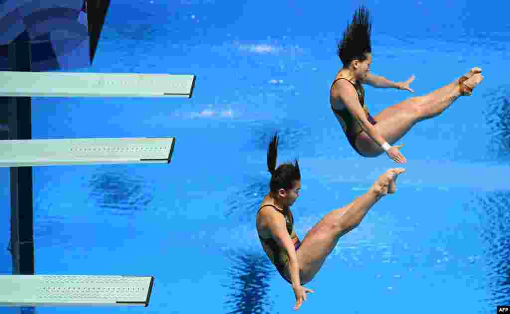 Malaysia's Sabri Nur Dhabitah and Ng Yan Yee perform in the women's synchronized 3m springboard event during the 2018 Asian Games in Jakarta, Indonesia.