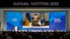 Ukrainian President Volodymyr Zelenskyy is displayed on a screen as he addresses the audience from Kyiv during the World Economic Forum in Davos, Switzerland, May 23, 2022.