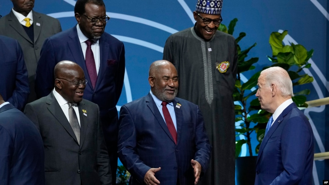U.S. President Joe Biden talks with African leaders before they pose for a family photo during the U.S.-Africa Leaders Summit at the Walter E. Washington Convention Center in Washington, Dec. 15, 2022.