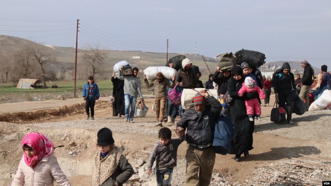 More than 11 million Syrians are displaced at home or abroad, with many having fled their homes several times. Some are pictured here in Manbij, Syria, Feb. 21, 2020. (Heather Murdock/VOA)