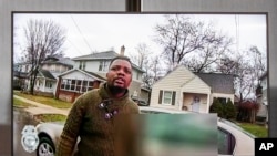 A TV display shows video evidence of a Grand Rapids police officer struggling with and shooting Patrick Lyoya at Grand Rapids City Hall on Wednesday, April 13, 2022. Lyoya, 26, was shot and killed about 8:10 a.m., on April 4, after what police said was a traffic stop.
