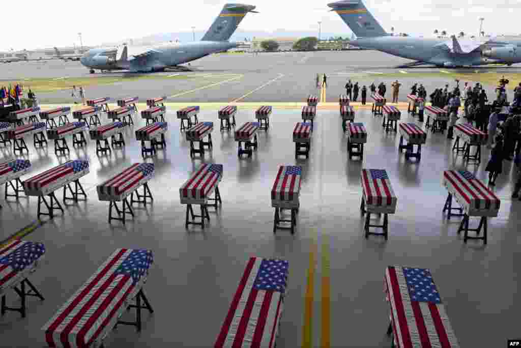Flag draped transfer cases with the remains of American soldiers repatriated from North Korea are seen during a repatriation ceremony after arriving to Joint Base Pearl Harbor-Hickam, Honolulu, Hawaii, Aug. 1, 2018. Sixty-five years after the Korean War ended, the remains of dozens of American soldiers killed during the brutal conflict are finally coming home.