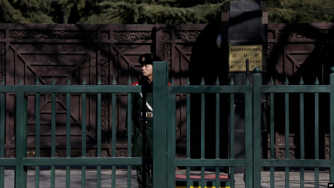 FILE - A Chinese paramilitary policeman stands guard outside the North Korean Embassy in Beijing, Feb. 7, 2016.