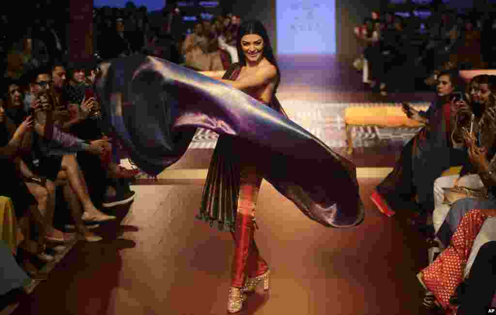 Bollywood actress Sushmita Sen walks the ramp to showcase the creation of designer Sunita Shanker during Lakme fashion week winter 2018 in Mumbai, India, Thursday, Aug. 23, 2018.