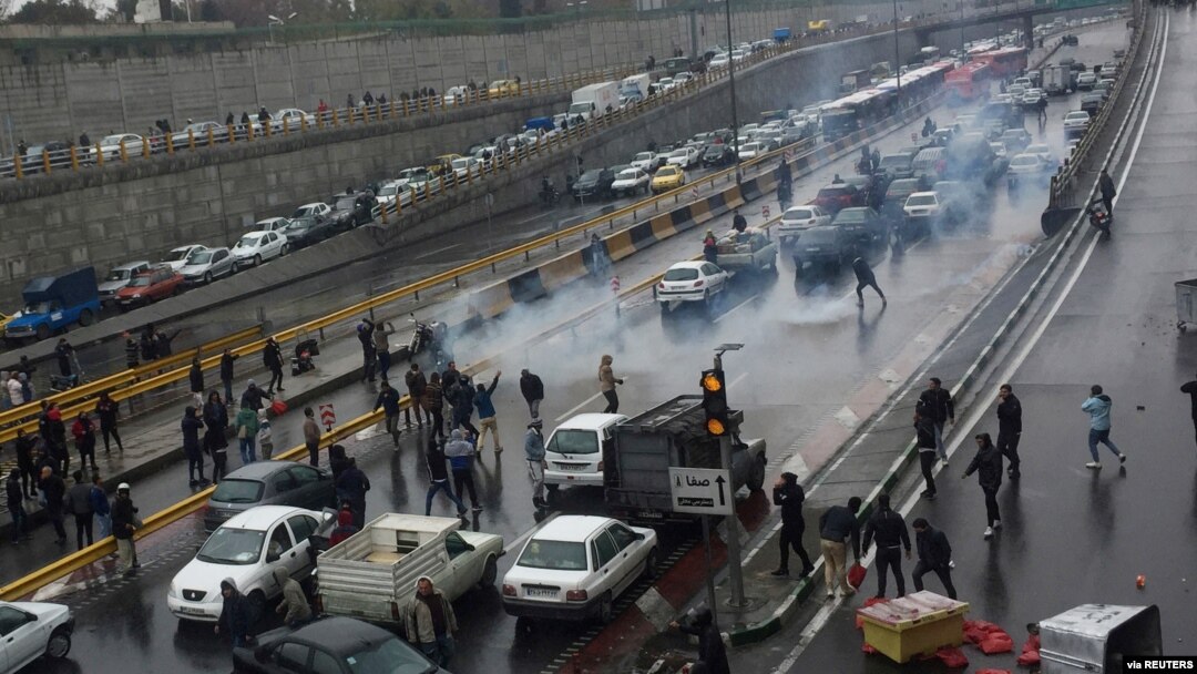 FILE - People protest against increased gas price, on a highway in Tehran, Iran, November 16, 2019. 