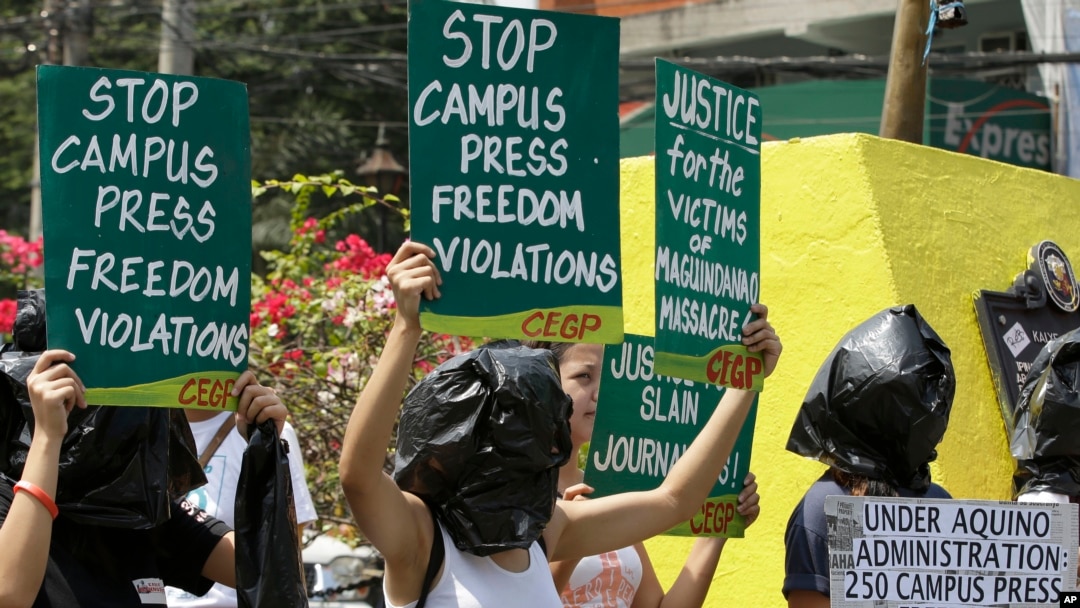 FILE: Protesters wear black plastic bags to symbolize injustice during a rally marking World Press Freedom Day, in Manila, Philippines.