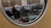 Far from Beijing, Families Struggle With COVID's Toll
