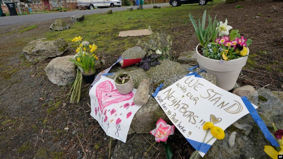 Flowers and messages of support are shown near the International Full Gospel Fellowship church, Thursday, March 18, 2021, in Seattle. The church was one of two in the neighborhood that were hit with anti-Asian graffiti earlier in the week, one of…