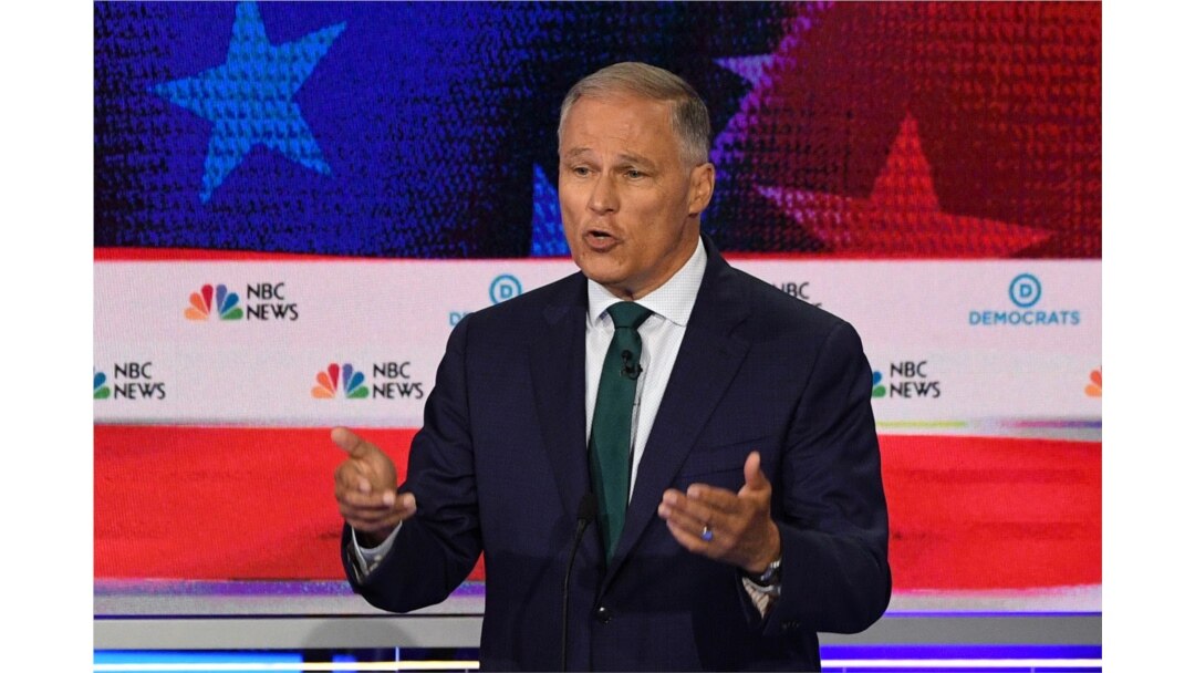 FILE - Jay Inslee speaks during the first Democratic primary debate of the 2020 presidential campaign season at the Adrienne Arsht Center for the Performing Arts in Miami, June 26, 2019.