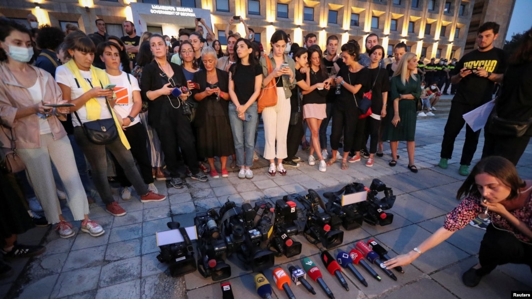 Members of the media gather in memory of Pirveli TV channel cameraman Alexander Lashkarava, a victim of violence against LGBT+ activists and journalists last Monday, in front of the Office of the Georgian government, in Tbilisi, Georgia, July 11, 2021. 