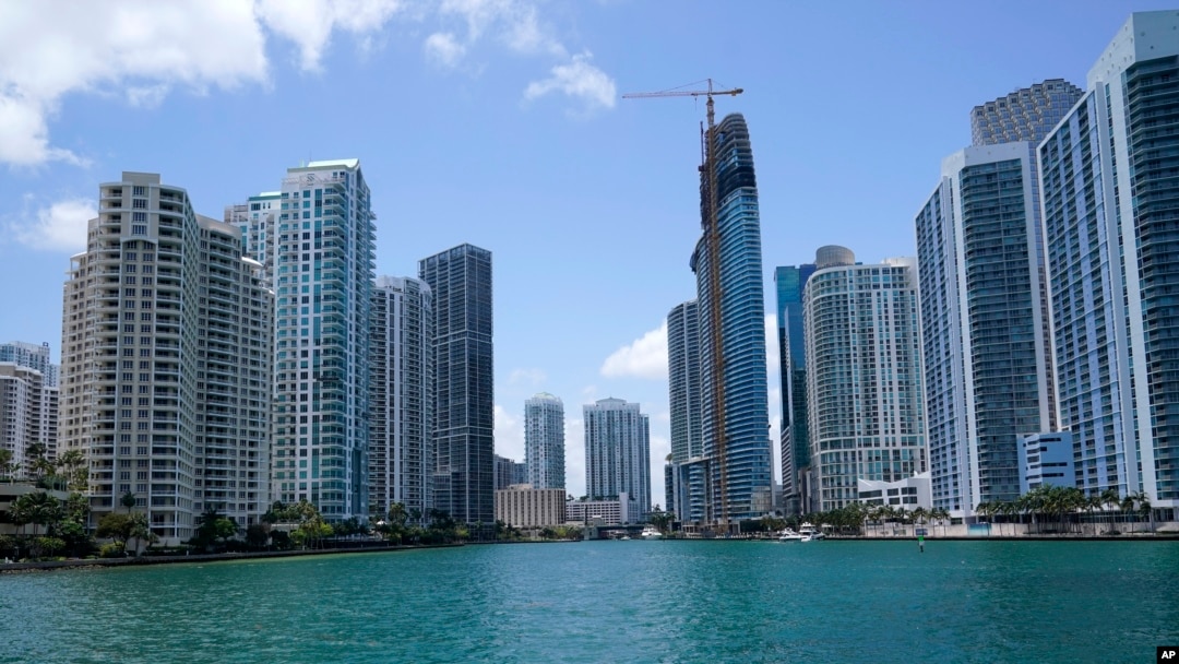FILE - The skyline of Miami is seen at the entrance to the Miami River from a boat on Biscayne Bay, May 9, 2022.