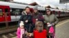 Left to right: 3-year-old Ulya Nochovna, 40-year-old Maria Nochovna, 18-year-old Anna Nochovna and 70-year-old Tatiana Novhovna at Przemysł station in Poland, on their way to Krakow, March 6, 2022. (H. Ridgwell/VOA)