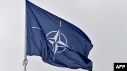 FILE - A flag of the North Atlantic Treaty Organization (NATO) flies at its headquarters in Brussels on Nov. 16, 2022. 