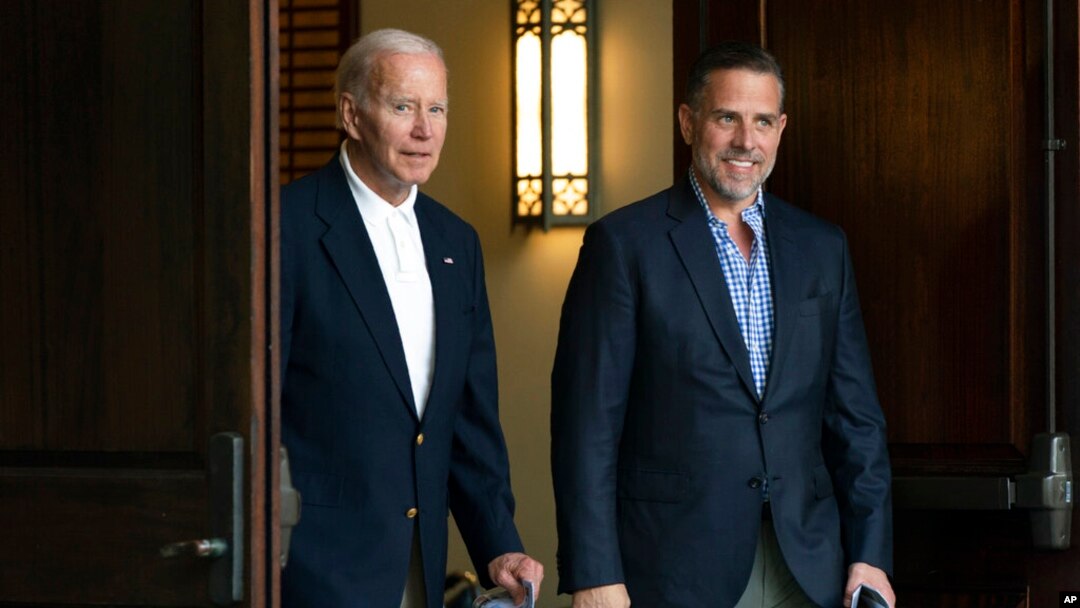 FILE - President Joe Biden and his son Hunter Biden are seen leaving a church service in Johns Island, South Carolina, Aug. 13, 2022, while on a family vacation in the area.