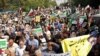 Iranians march during a pro-hijab rally in Tehran, Sept. 23, 2022. They paid tribute to security forces who have moved to quell a week of protests by what official media called "conspirators."